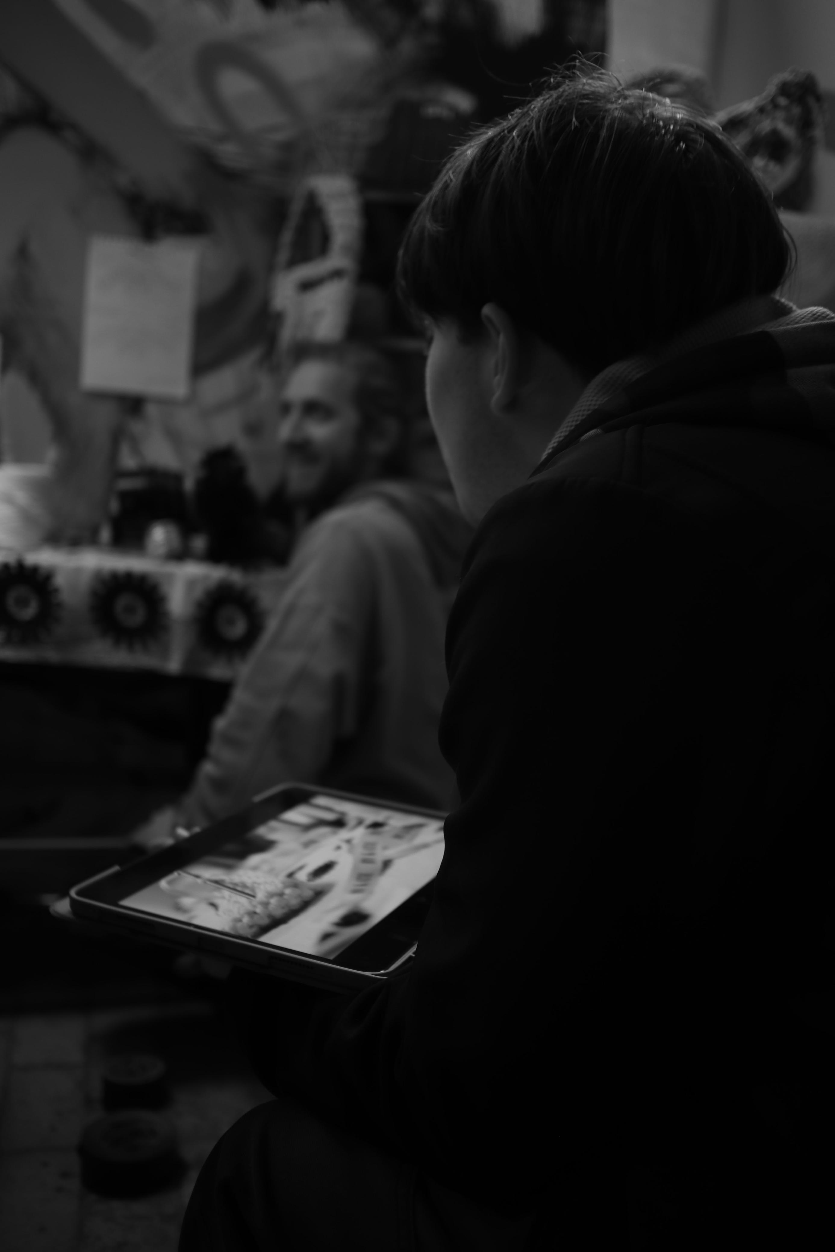 Papa Production mobile website displayed on a phone against a dark backdrop